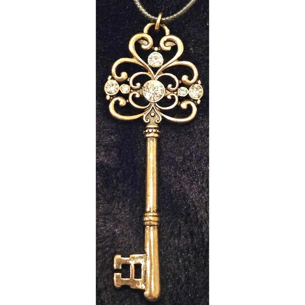 KEY NECKLACE W/ RHINESTONES GOLD TONED NECKLACE KEY IS OVER 15" LONG!